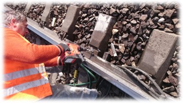 Cleaning the hole after a broken rail spike